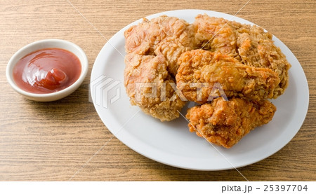 Fried Chicken with Sauce on A White Dish 25397704