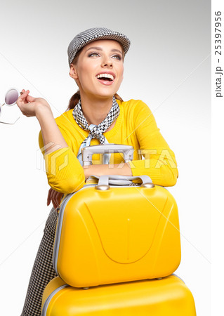 Vintage woman with yellow suitcase. travel concept Vintage woman with yellow suitcase. travel concept 25397956
