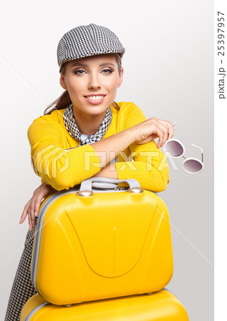 Vintage woman with yellow suitcase. travel concept Vintage woman with yellow suitcase. travel concept 25397957
