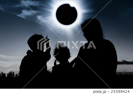 Silhouette of family look at solar eclipse on dark Silhouette of family look at solar eclipse on dark 25399424