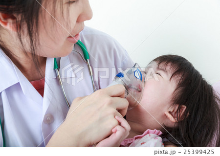 Asian girl having respiratory illness by doctor. 25399425