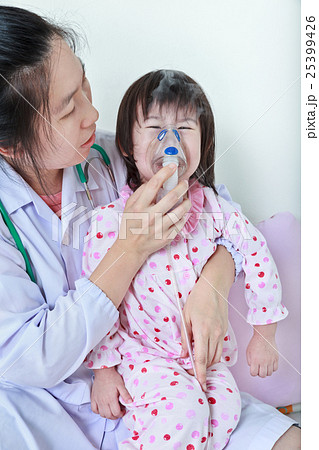 Asian girl having respiratory illness by doctor. Asian girl having respiratory illness by doctor. 25399426