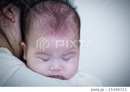Mother and baby, asian girl resting with mother Mother and baby, asian girl resting with mother 25399723