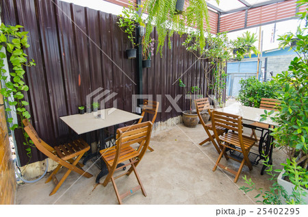 Outdoor coffee shop with tables and chairs Outdoor coffee shop with tables and chairs 25402295