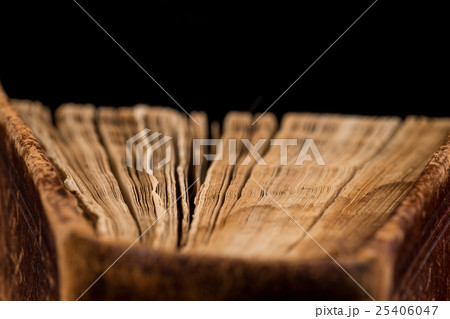 ancient book shot on black background 25406047