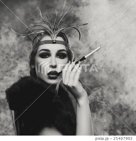 Beautiful girl with smoky eyes and red lips Beautiful girl with smoky eyes and red lips 25407902