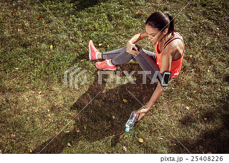 Young girl having rest after morning exercises 25408226