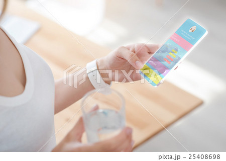 Pleasant woman using smart phone 25408698