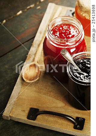 Fruit and berry jam on a wooden background Fruit and berry jam on a wooden background 25413698