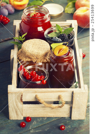 Fruit and berry jam on a wooden background Fruit and berry jam on a wooden background 25413699