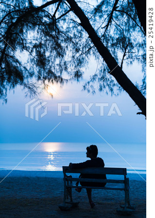Woman at night with the moon on the Beach Woman at night with the moon on the Beach 25419428