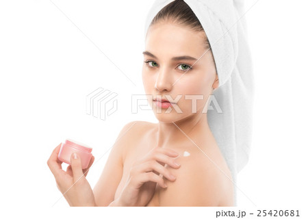 Woman with clean face and towel on her head Woman with clean face and towel on her head 25420681