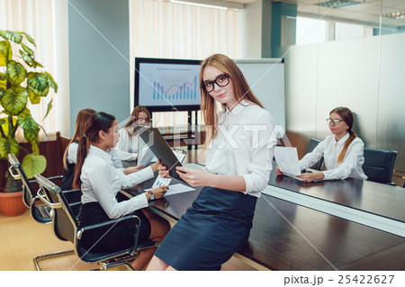 Beautiful business woman in glasses on the team's Beautiful business woman in glasses on the team's 25422627