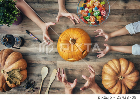 family preparing for Halloween. 25423709