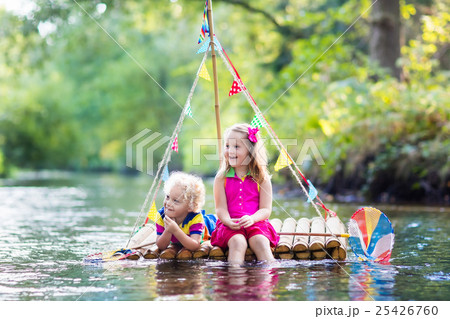 Kids on wooden raft Kids on wooden raft 25426760