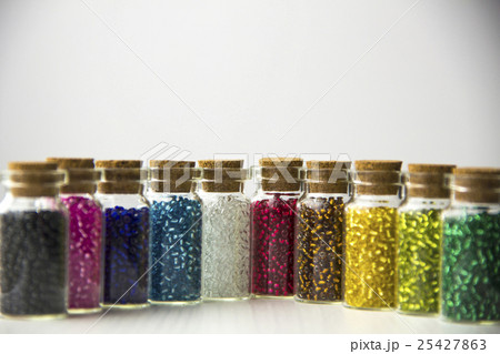 Tiny glass bottles filled with beads Tiny glass bottles filled with beads 25427863