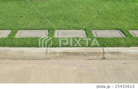 Gravel texture and strip grass with concrete road Gravel texture and strip grass with concrete road 25435613