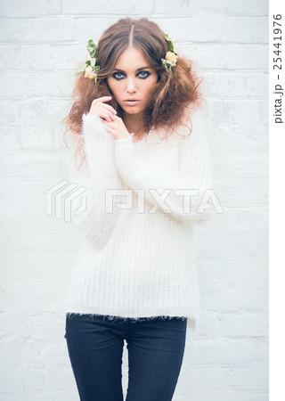 Beautiful girl on brick wall background Beautiful girl on brick wall background 25441976
