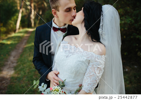 Beautiful wedding couple kissing 25442877