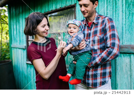 young family with a child on the nature young family with a child on the nature 25442913