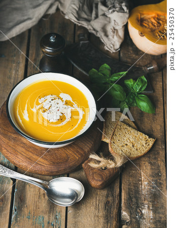 Pumpkin cream soup with fresh basil, spices and Pumpkin cream soup with fresh basil, spices and 25450370