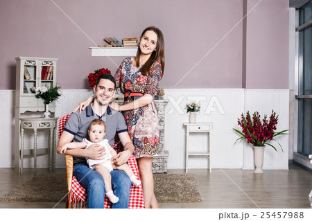 Young happy family with their little daughter Young happy family with their little daughter 25457988