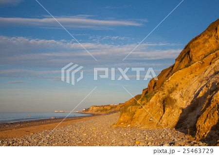 Sheringham beach and cliffs at sunset,,England 25463729