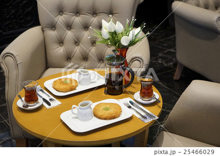 kettle, cups with tea and Eastern Turkish sweets 25466029