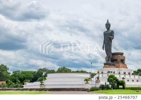 Buddha statue beside in decorated garden 25466707