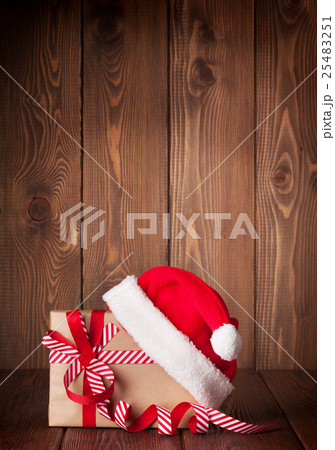 Christmas gift box and santa hat 25483251
