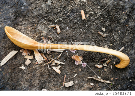 side view of wooden spoon carved from Alder wood side view of wooden spoon carved from Alder wood 25483371