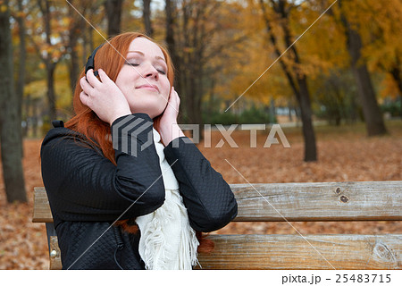 redhead girl in autumn city park yellow leaf fall redhead girl in autumn city park yellow leaf fall 25483715