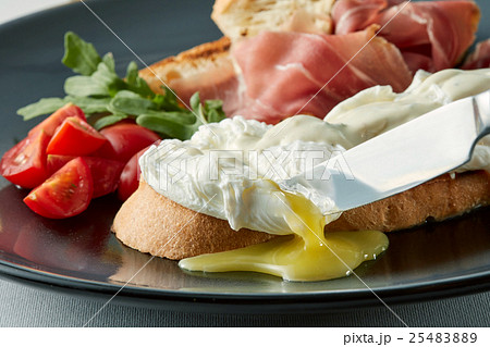 Poached eggs on buttered wholemeal toast breakfast Poached eggs on buttered wholemeal toast breakfast 25483889