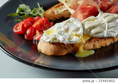 Poached egg on a piece of bread Poached egg on a piece of bread 25483902