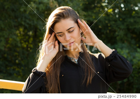 Young woman on the background of trees 25484990