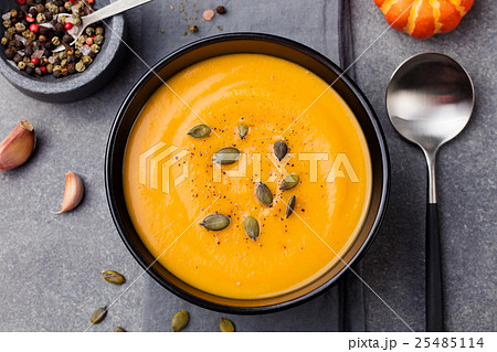 Pumpkin and carrot soup with seeds Top view Pumpkin and carrot soup with seeds Top view 25485114
