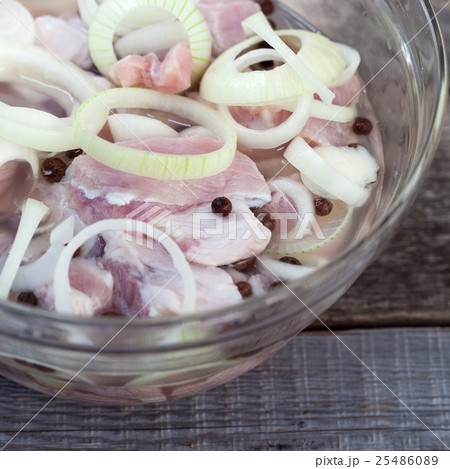 Marinating meats, pork, onion and pepper Marinating meats, pork, onion and pepper 25486089