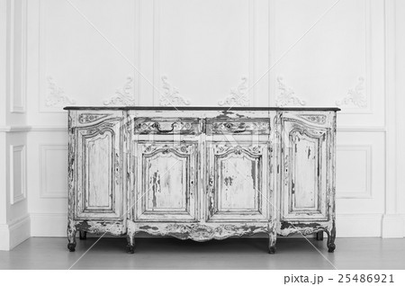 Ancient white commode bureau with paint peeled off 25486921