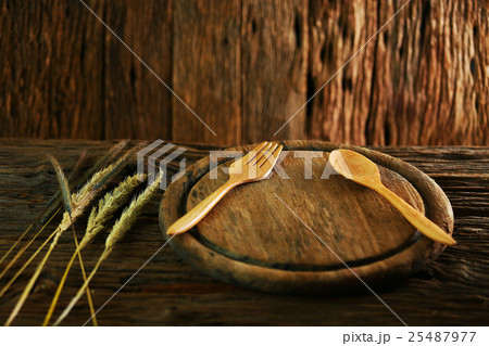 wood dish on old wooden table with spoon set  25487977