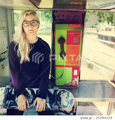 Woman Sitting Telephone Skateboard Concept Woman Sitting Telephone Skateboard Concept 25494129