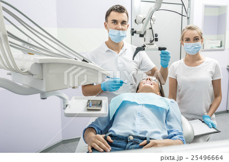 Dentist, assistant and patient in clinic 25496664