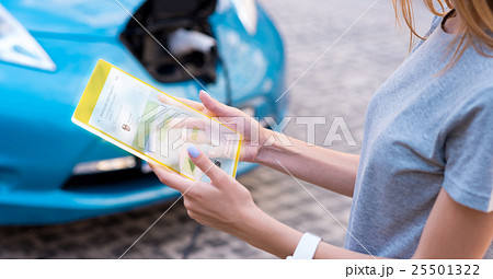 Pleasant young woman using modern device 25501322