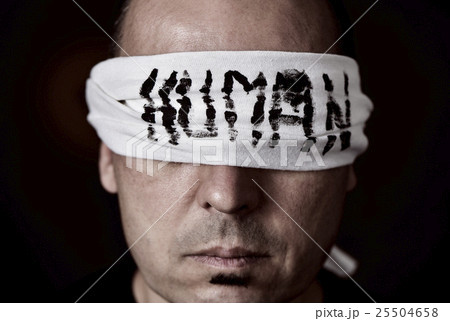 young man with a blindfold in his eyes young man with a blindfold in his eyes 25504658