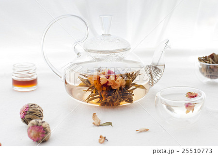 Traditional asian floral tea in a glass teapot 25510773