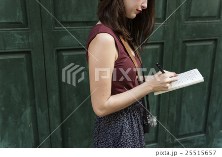 Woman Making Notes Outside City Concept Woman Making Notes Outside City Concept 25515657
