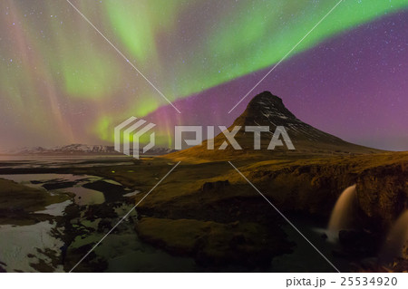 Northern lights night view over Kirkjufell volcano Northern lights night view over Kirkjufell volcano 25534920