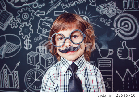 Little boy as businessman or teacher with mustache Little boy as businessman or teacher with mustache 25535710