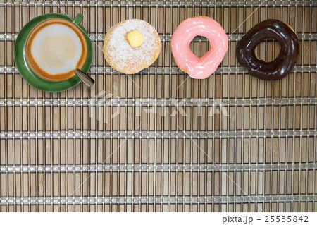 Cappuccino coffee donut on bamboo background Cappuccino coffee donut on bamboo background 25535842