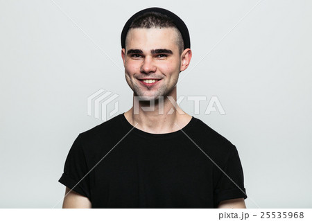Portrait of young toothy smiling man 25535968