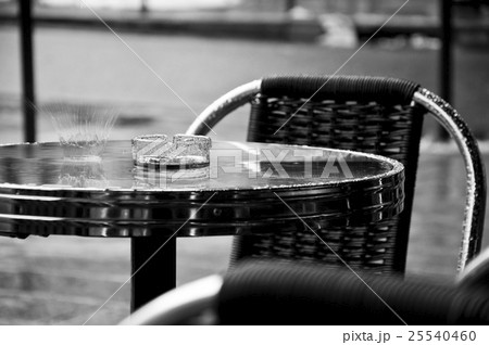 rain falling on a restaurant table in outdoor 25540460